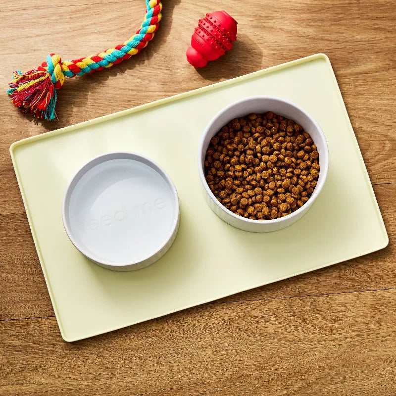 Medium Silicone Pet Feeding Mat, Beige, 19" x 12"，Raised edge design helps contain food and water.